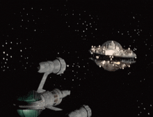 a space ship is flying in the night sky with a planet in the background .
