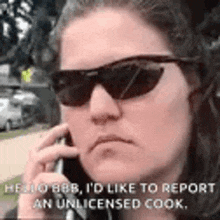a woman wearing sunglasses is talking on her cell phone .