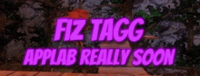 a purple sign says fiz tagg applab really soon