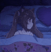 a girl in a white dress is laying on a bed holding a heart