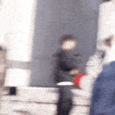 a blurry picture of a man standing in front of a mirror