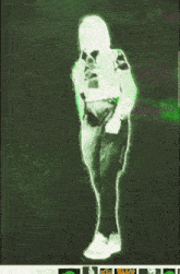 a green glowing image of a person with a gun on a green background