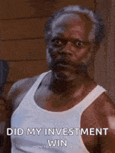 a man with a beard and a white tank top is making a funny face and saying `` did my investment win '' .