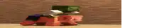 a turtle and a pig are riding on top of each other on a table .