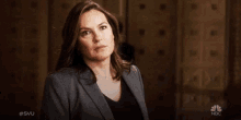 a woman says " what " in front of a door