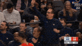 a philadelphia basketball game is being played in front of a crowd of people