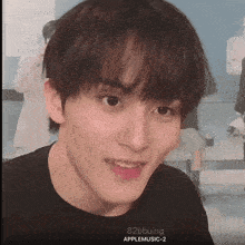 a close up of a young man 's face with the words 82bbuing on the bottom right