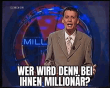 a man in a suit and tie is standing in front of a sign that says miller .