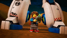 a lego character wearing a shirt that says bl stands next to a robot