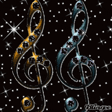 a picture of a treble clef and a bass clef with rhinestones on them