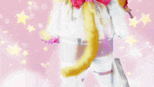 a woman with a yellow tail and a pink bow on her back