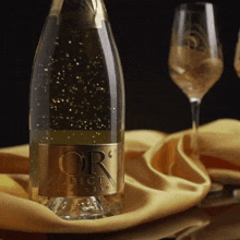 a bottle of or addict champagne sits on a table