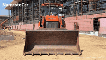 a bulldozer is on a construction site with the name namastecar written on the bottom