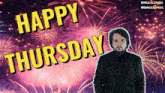 a man is standing in front of a fireworks display and says happy thursday
