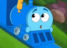 a blue cartoon train with big eyes is going down the tracks .
