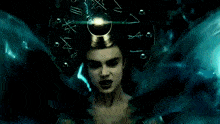a woman with her eyes closed is wearing a crown with chinese writing on it