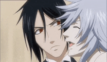 a couple of anime characters are standing next to each other and one has a red eye