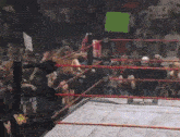 a woman in a wrestling ring with a sign that says 85