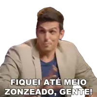 a man in a suit says " fiquei até meio zonzeado gente "
