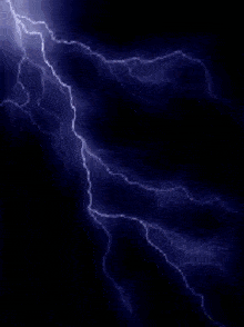 a lightning bolt in the dark sky with a purple background