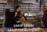 a group of people are fighting in a store with the words " leave town leave the country " written on the bottom