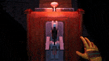 a person wearing a yellow glove is pushing a button