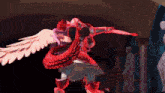 a statue of a man with wings and a sword in his hand