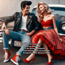 a man in a leather jacket sits next to a woman in a red dress who is sitting on the back of a car