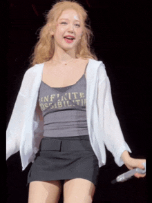 a woman in a tank top that says " infinite possibilities "
