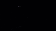 a flashlight is shining on a person 's face in a dark room