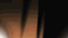 a blurred image of a person 's feet in the dark