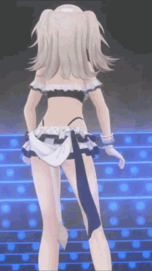 a girl in a maid costume is standing on a stage