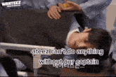 a man is laying on a bed with the words " ateez can 't do anything without our captain "
