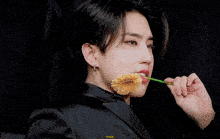 a close up of a person with a flower in their mouth that says happy on it