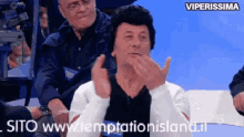 a man covering his mouth with his hands with the words viperissima on the bottom