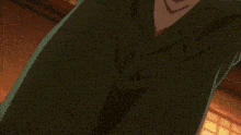 a man in a tuxedo and bow tie is pointing at something .