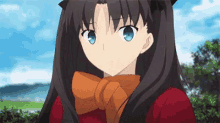 a close up of a girl with long black hair and blue eyes wearing a red shirt and a scarf .
