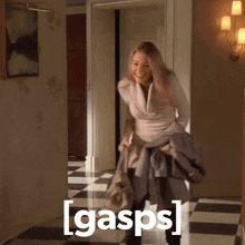 a woman in a hallway with gasps written on the bottom