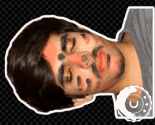 a man with red and black paint on his face has a sticker that says u on it