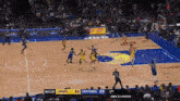 a basketball game between the lakers and the capitanes is being played