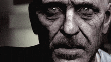 a close up of a man 's face with his eyes closed