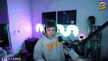 a man wearing headphones and a sweatshirt that says seriously on it