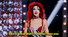 a drag queen with red hair is saying this is proof that i 'm better than you