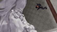 a statue of a man is flying through the air .