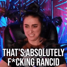 a woman wearing headphones is sitting in a chair with the words `` that 's absolutely fucking rancid '' .