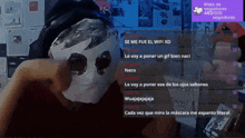 a person wearing a mask is talking to another person on a live stream