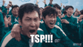 a group of people are screaming with the words tsp !!!