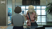 a man in a pink shirt is talking to a woman in front of a sign that says as