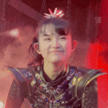 a girl with a star in her hair is smiling