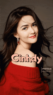 a woman in a red sweater with the name cinhdy on her back